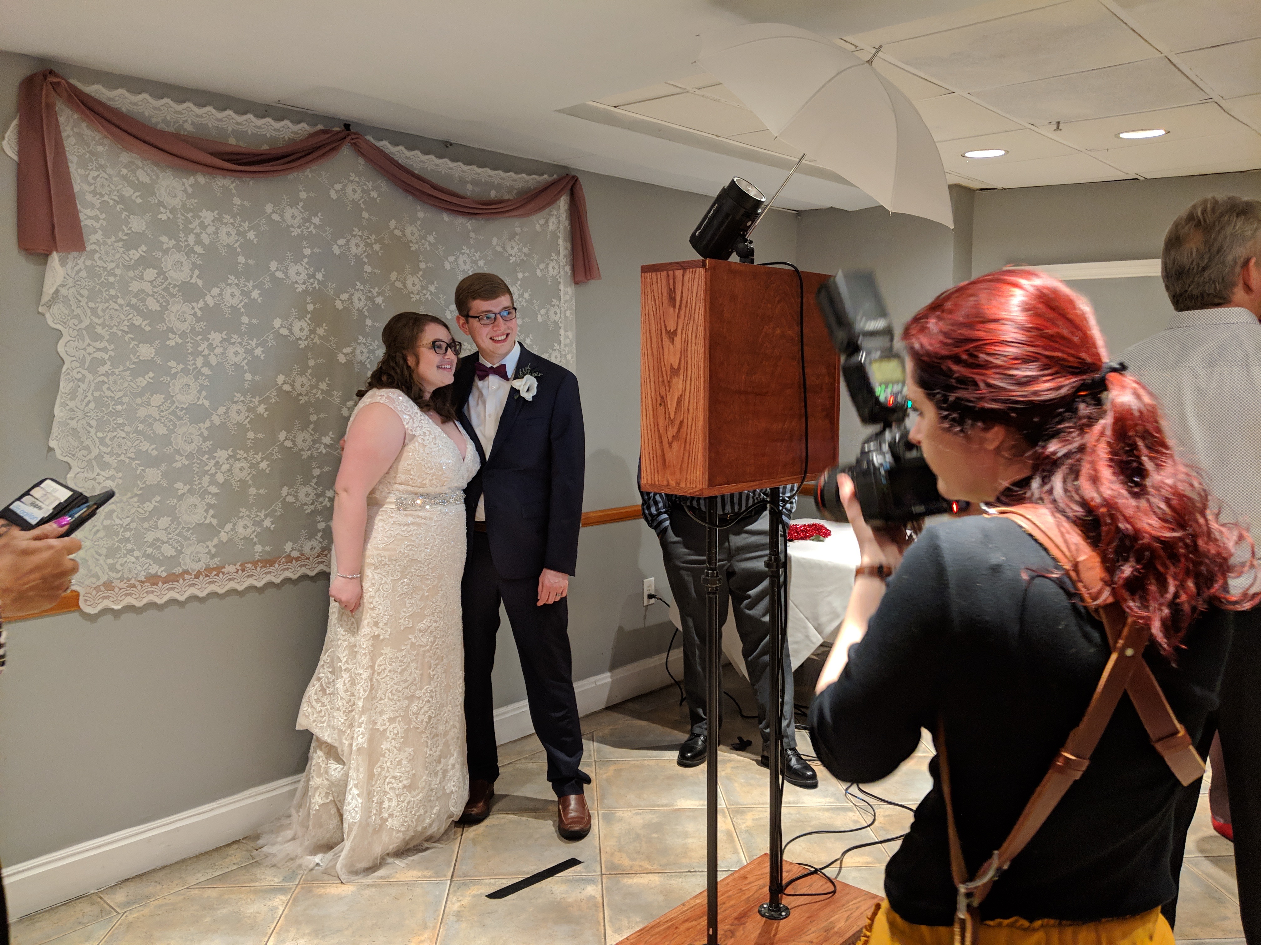 Guests posing with props in the photobooth